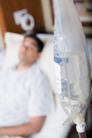 Sick man in a hospital bed, representing this spiritually sick world